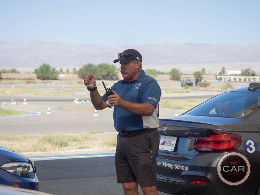 Driving instructor, Raoul, demonstrates proper technique at BMW Performance Driving School
