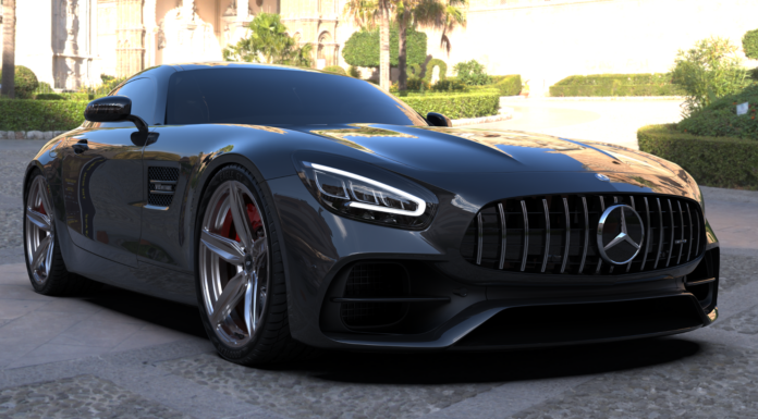 The Ultimate Guide to Magnesium Wheels for Cars A black performance coupe parked outdoors, showcasing lightweight magnesium wheels and large brake calipers.