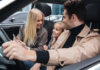Road-Trip Ready: 6 Cabin-Comfort Upgrades That Make Long-Haul Driving Less Exhausting Family sitting inside a car and smiling together during a drive, representing a quieter and more comfortable cabin experience with automotive sound deadening materia